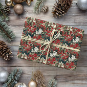 Rode traditionele kerstbloem en pinecone cadeaupapier