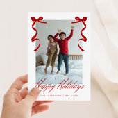 Rode vakantiehand getrokken grillige strikken feestdagenkaart