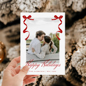 Rode vakantiehand getrokken grillige strikken feestdagenkaart