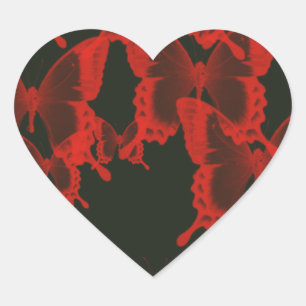 rode vlinder tegen donkere achtergrond hart sticker