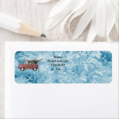 rode vrachtwagen op een blauwe sneeuwvlok etiket (Insitu)