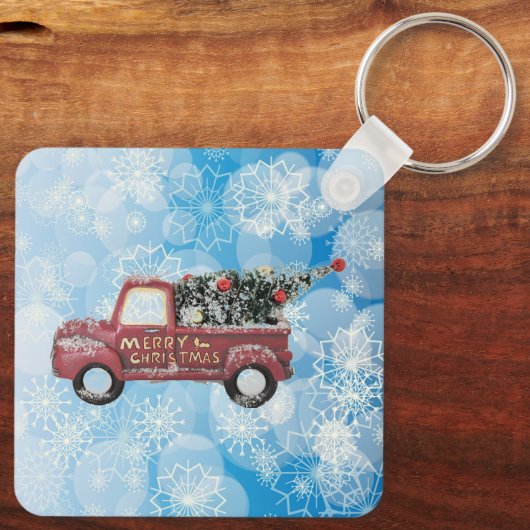 rode  vrachtwagen op een blauwe sneeuwvlok sleutelhanger (Achterkant)
