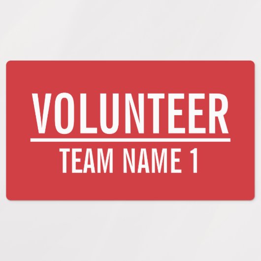 Rode vrijwilligersbadge met de naam van het Team v Labels (Design 1)