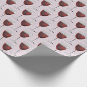 Rode wijn op roze cadeaupapier (Hoek)