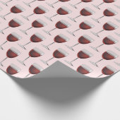 Rode wijn op witte roze cadeaupapier (Hoek)