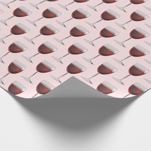 Rode wijn op witte roze cadeaupapier (Hoek)