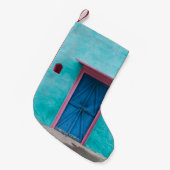 RODE WOODEN DEUR OP BLAUWE CONCRETE WALL KLEINE KERSTSOK (Voorkant (Hangend))