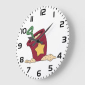 Rode zandemmer met ster en schop grote klok (Hoek)