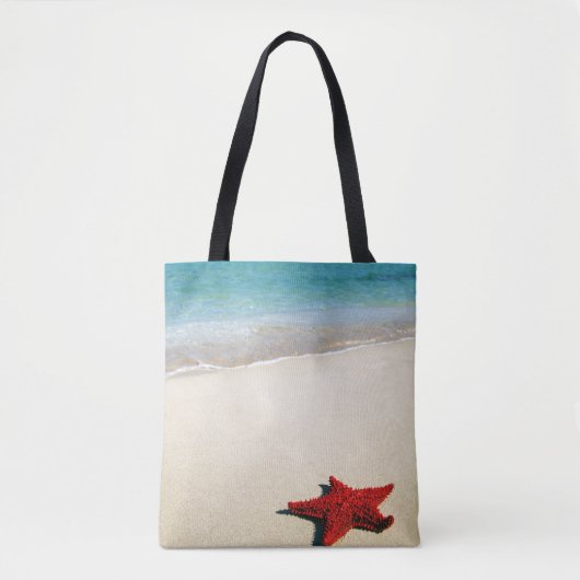 Rode zeester op witte zandband tote bag (Voorkant)