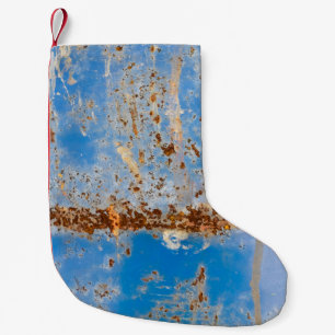 Roestige metalen textuur, blauw krassend decor. kleine kerstsok