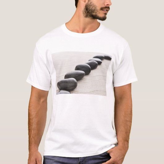 Rokken op zand t-shirt (Voorkant)