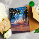 Romantic Tropical Summer Beach Wedding Kaart<br><div class="desc">Viel je speciale dag in stijl met onze exclusieve strandbruiloft-uitnodiging! Maak je zomerbruiloft nog gedenkelijker met onze droomachtige zonsondergang, snaarlampen en tropische palmbomen, waardoor je gasten een magische reservervaring krijgen op je bestemmings bruiloft. Wij maken het eenvoudig om uw uitnodiging aan te passen met online papieren opties en direct downloaden,...</div>