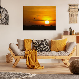 Romantische oranje zonsondergang met vliegende kra poster
