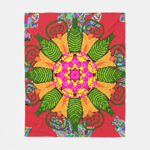 Rond bloemmandala gekleurd op een rood, groen en fleece deken