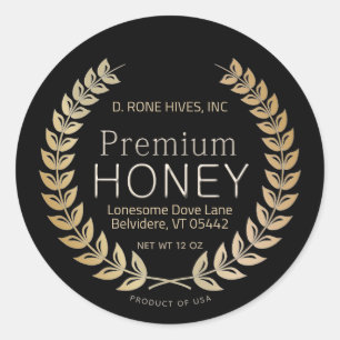 Rond zwart honing label met gouden laurierkrans