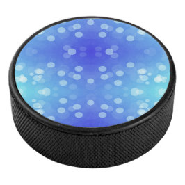 Ronde blauwe Bluetooth-luidspreker met een vooront Hockey Puck