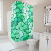 Ronde stenen in tinten van groen tot groen douchegordijn (In situ)