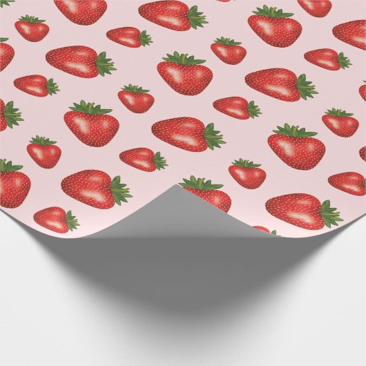 Rood aardbeienvruchtenpatroon op roze cadeaupapier (Hoek)