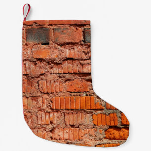 Rood bakstenen wandtextureel verlaten, veroudering kleine kerstsok