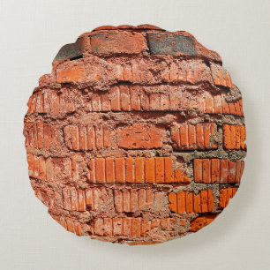 Rood bakstenen wandtextureel verlaten, veroudering rond kussen
