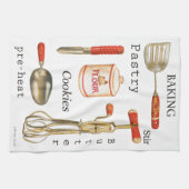 Rood behandeld  keukenbakgereedschap op handdoek. theedoek (Horizontaal)