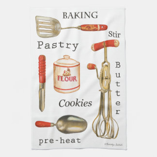 Rood behandeld  keukenbakgereedschap op handdoek. theedoek