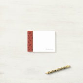 Rood bladeren patroon op sinaasappel post-it® notes (Op bureau)