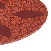 Rood bladeren patroon op sinaasappel snijplank (Hoek)