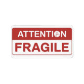 Rood breekbaar handvat met afbeeldingen op het was etiket (Voorkant)