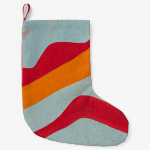 Rood en geel geschilderde wand kleine kerstsok