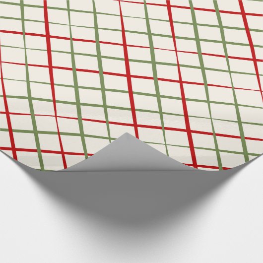 Rood en groen snijdsel op crème cadeaupapier (Hoek)