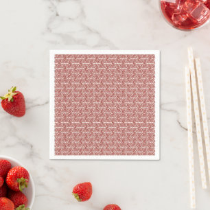 Rood en roze textiel gelegd over een pattereerde t servet