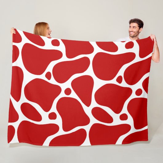 Rood en wit abstract girafpatroon fleece deken (In situ)