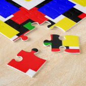 Rood, geel, zwart, blauw en groen legpuzzel (Zijkant)