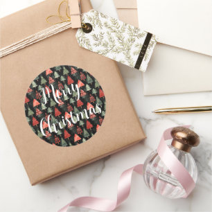 Rood & groen geplakte kerstbomen op zwart ronde sticker