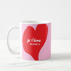 Rood hart met je t’aime-tekst op roze achtergrond koffiemok