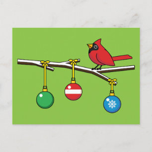 Rood kardinaal op kerstbaltak feestdagenkaart