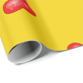 Rood kerstgerechten op geel cadeaupapier (Rol Hoek)