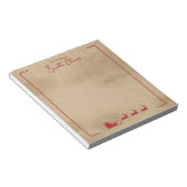 Rood kersthoes op oud papier met oude kleuren notitieblok (Schuin)