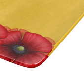 Rood maanbloem patroon op gele mosterd snijplank (Hoek)