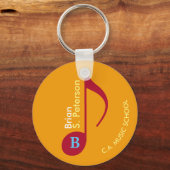 rood op gele muzieknoot met naam sleutelhanger (Voorkant)