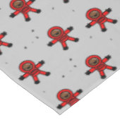 Rood pak astronauten op grijs tafelkleed (Gekanteld)