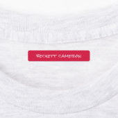 Rood wit strijkijzer op kleding labels (Aangebracht)