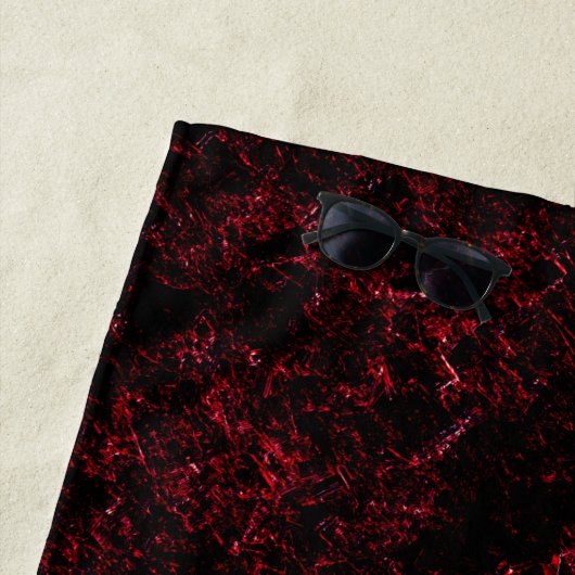 Rooddikke spons tegen donkerrode achtergrond strandlaken (In situ)