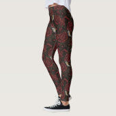 Roodstart in de chrysanten in bruin en rood leggings (Links)