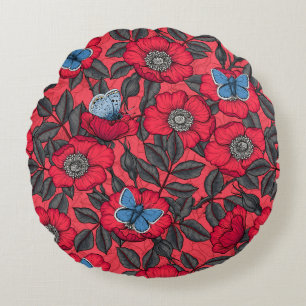 Roos en vlinders in rood en blauw rond kussen