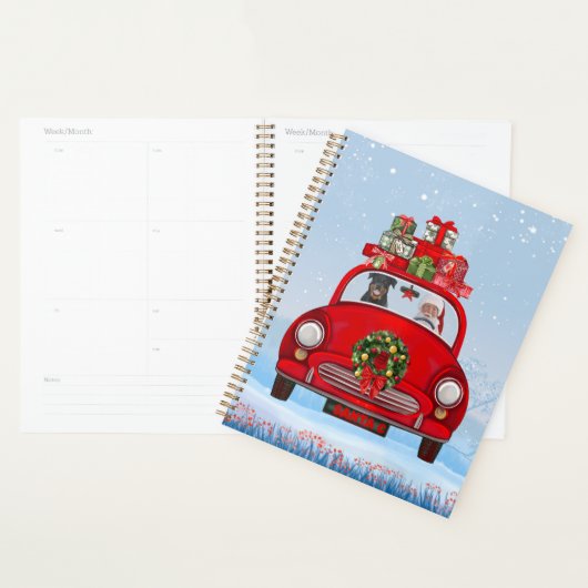 Rottweiler-hond in auto met kerstman planner (Display)
