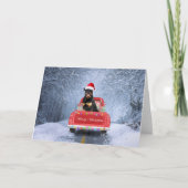 Rottweiler-hond in de sneeuw zittend in Kersttruck Kaart (Voorkant)