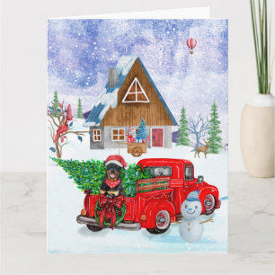 Rottweiler-hond in kerstbezorgingswagen sneeuw kaart