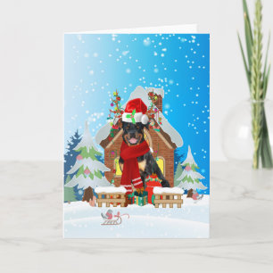Rottweiler in sneeuw met kerstcadeaus kaart
